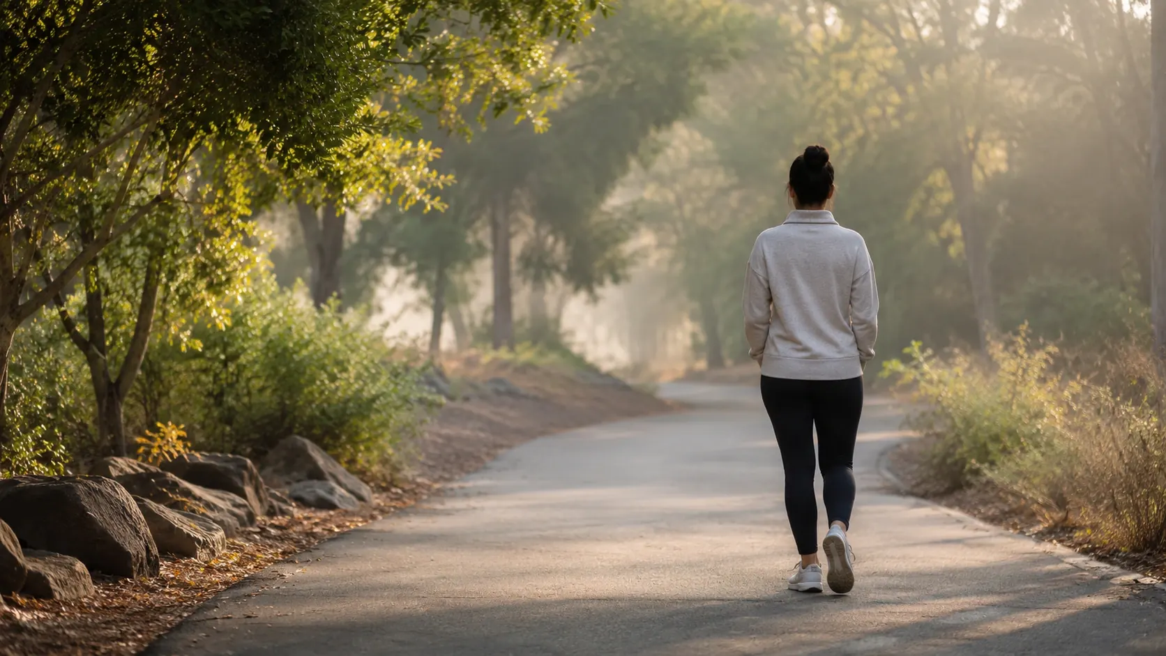 Person walking outdoors to reduce stress and reset the nervous system